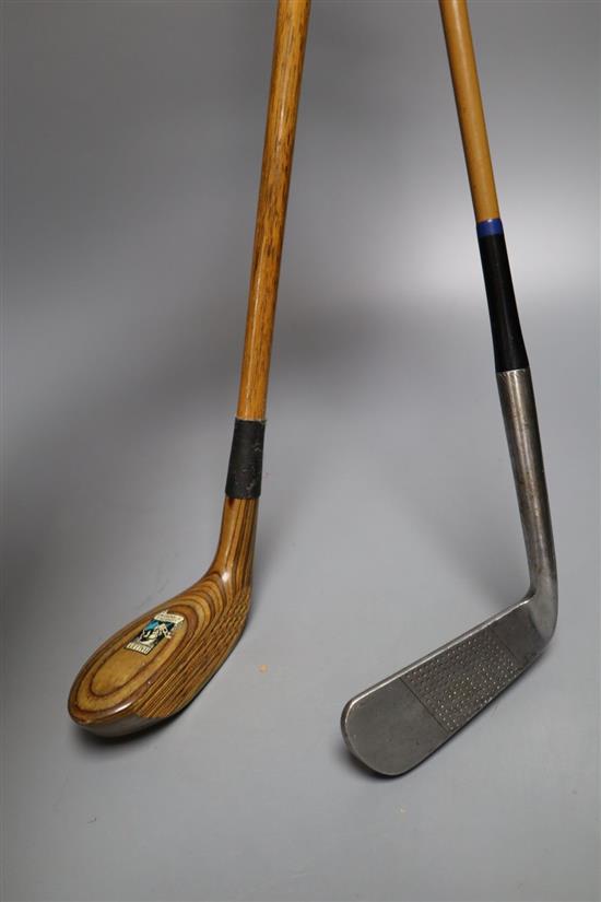 A vintage Halley St Andrews laminated hickory shafted putter and a Pin-hi brand putter with faux wood steel shaft